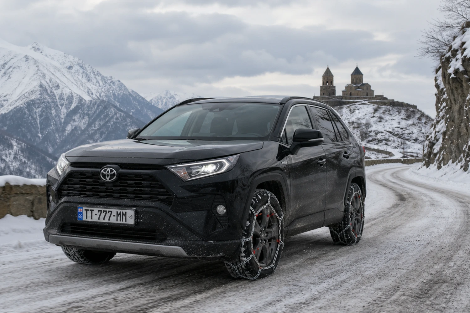 Toyota RAV4 on snow with snow chains