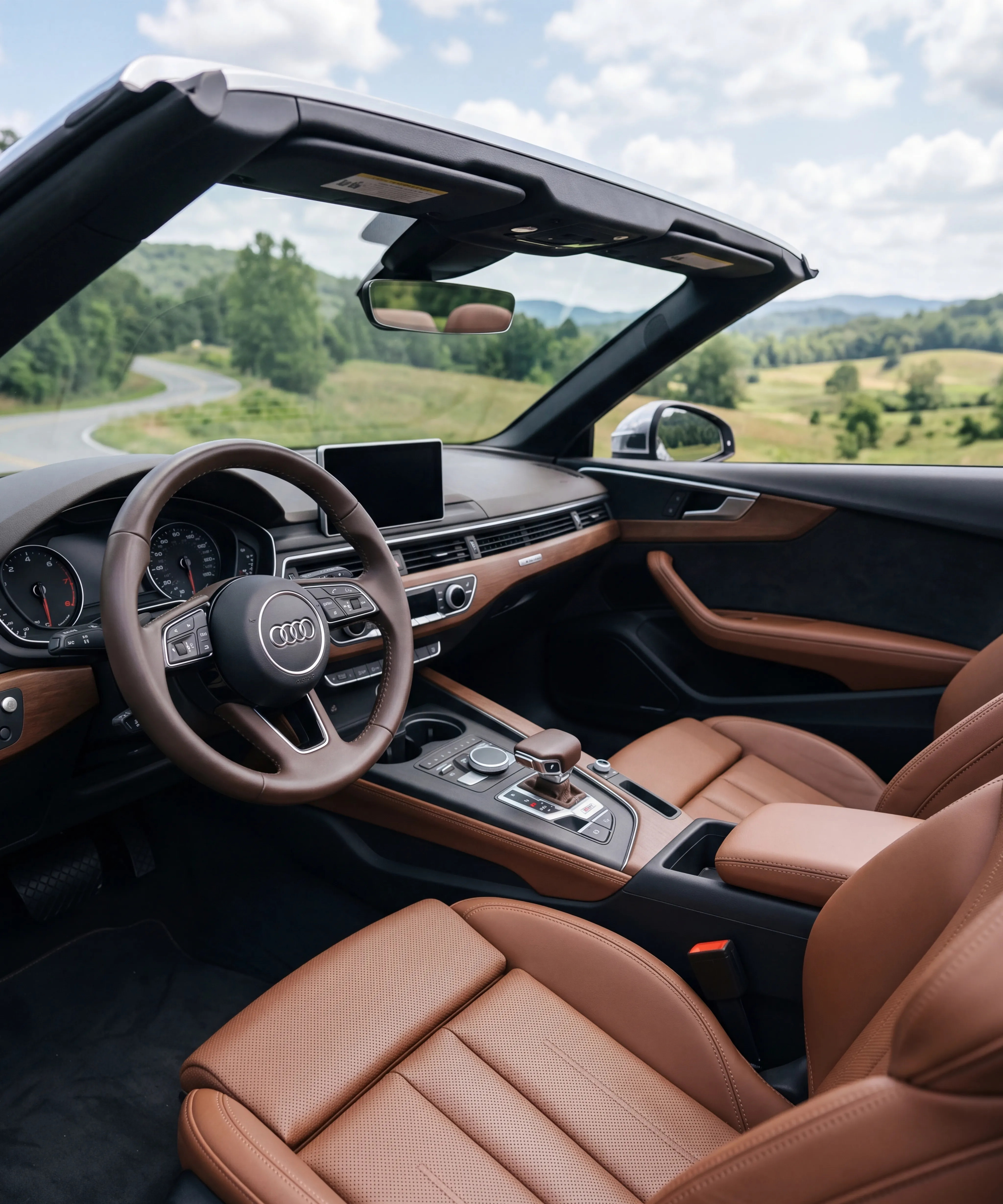 Modern rental car interior in Georgia with steering wheel, dashboard, and center console