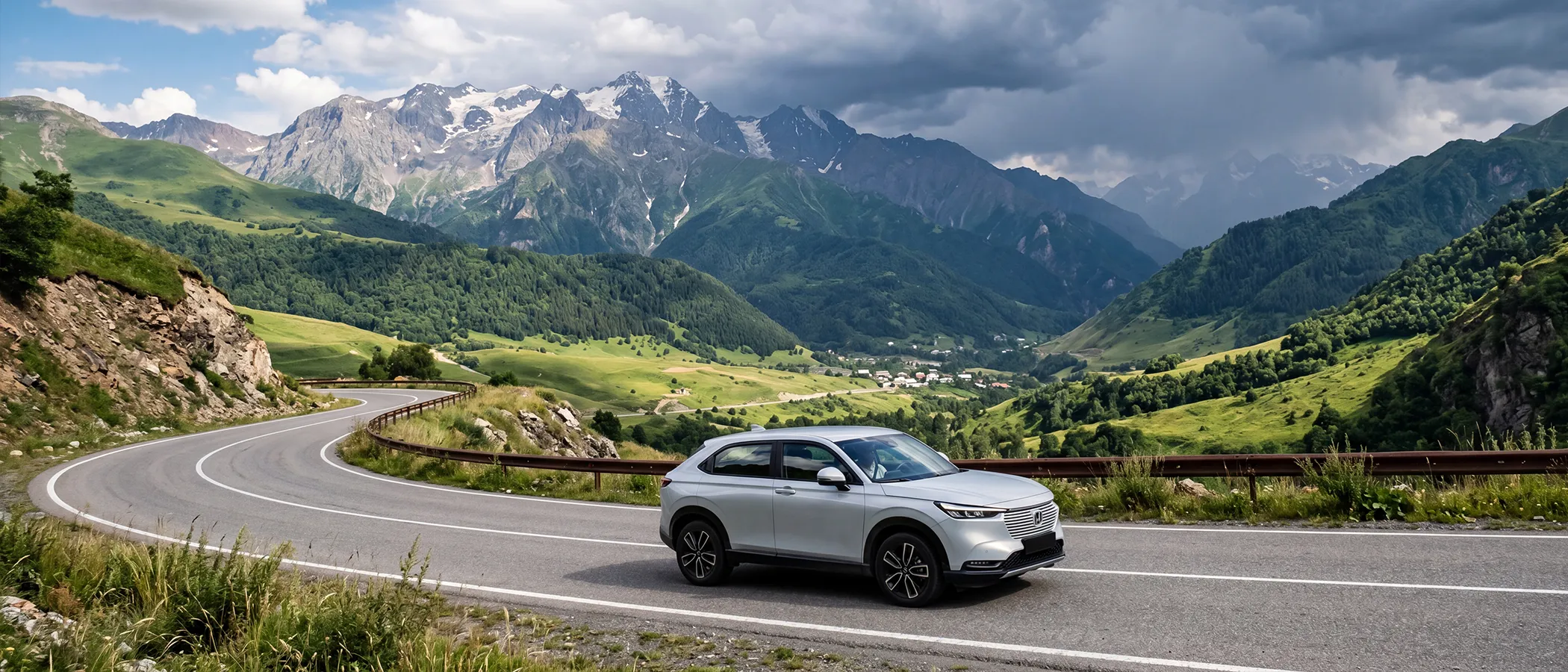 Rental SUV on a winding Georgian mountain road with changing weather over Caucasus valleys